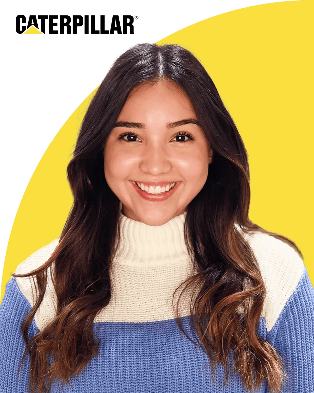 Professional headshot of a woman with long dark hair in a cream and blue sweater