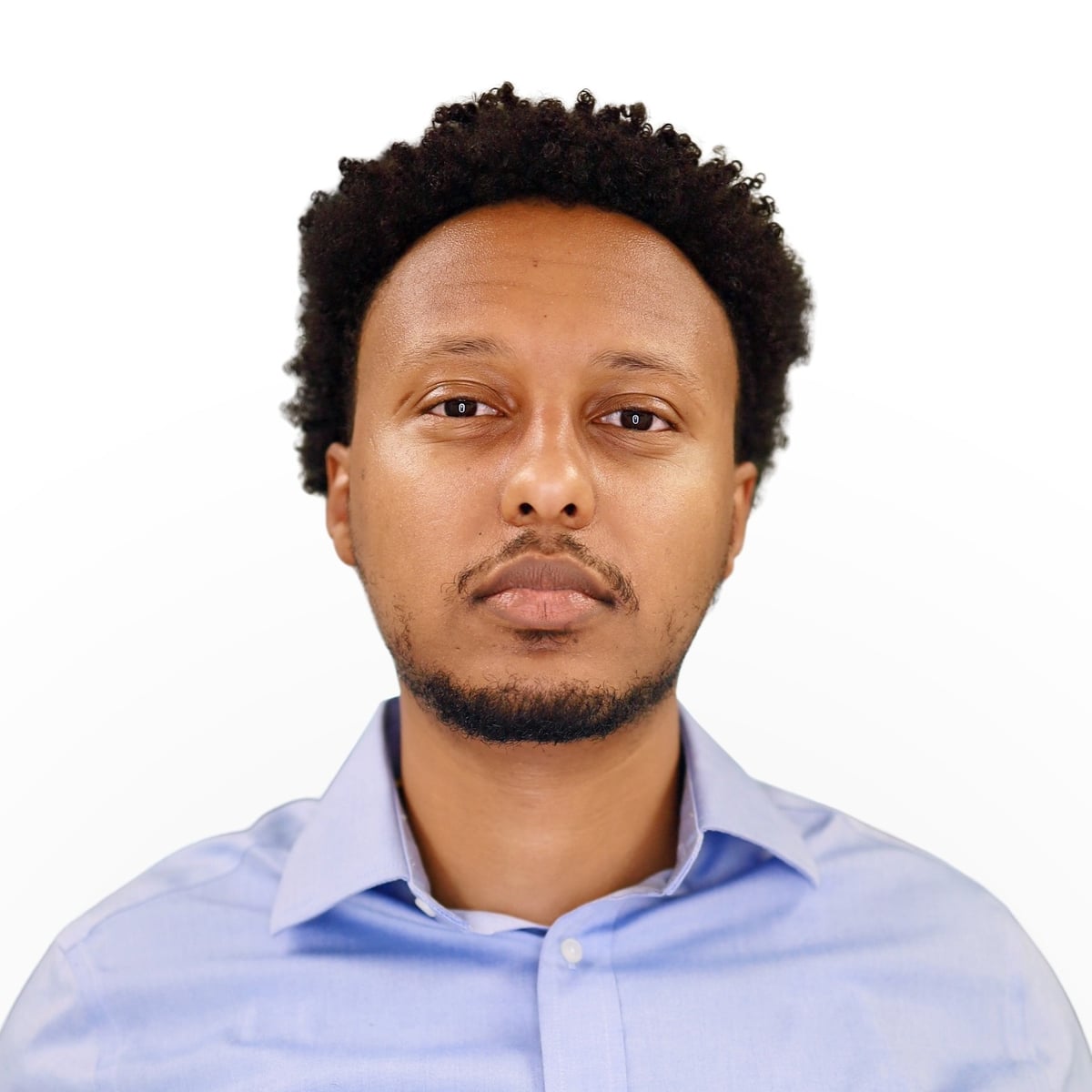Passport photo of a man in a light blue shirt, neutral expression, no glasses, on a plain white background